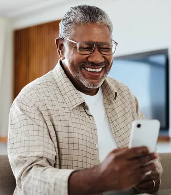 man using phone to set up bill payments