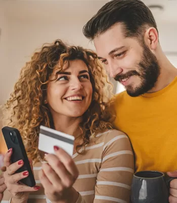 young couple using credit card