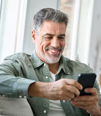 man using banking app on cell phone