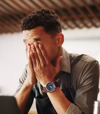 stressed man dealing with fraudulent situation