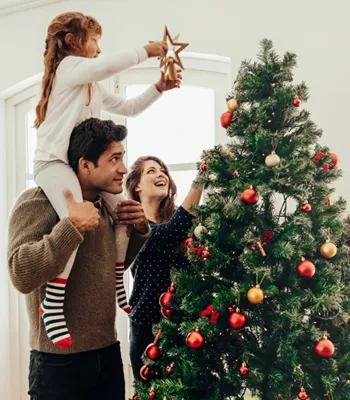 family decorating for the holiday season