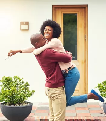 happy couple purchasing a home 