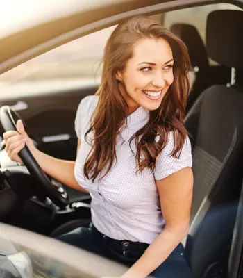 young woman in car