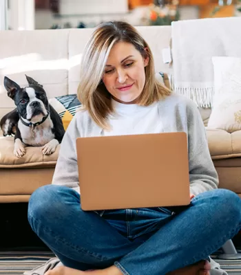 woman using computer to read blog