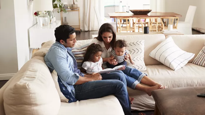 family sitting on couch