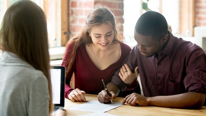 couple reviewing debt consolidation options with expert