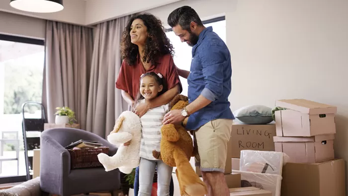happy family moving into new home