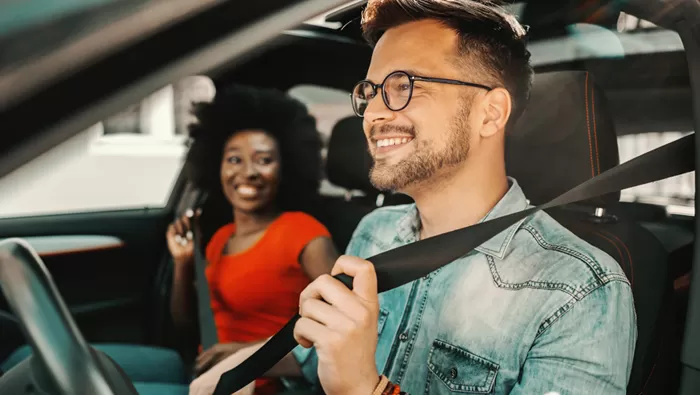 happy couple in car