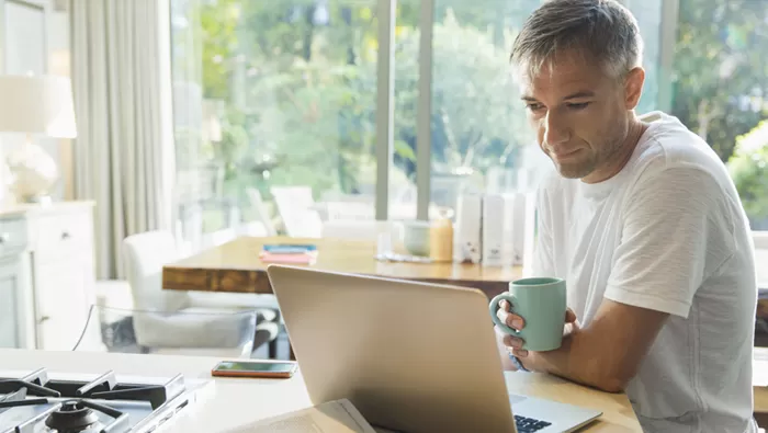 man reviewing computer