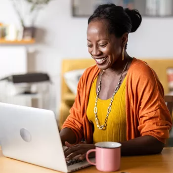 woman using computer to check bank account