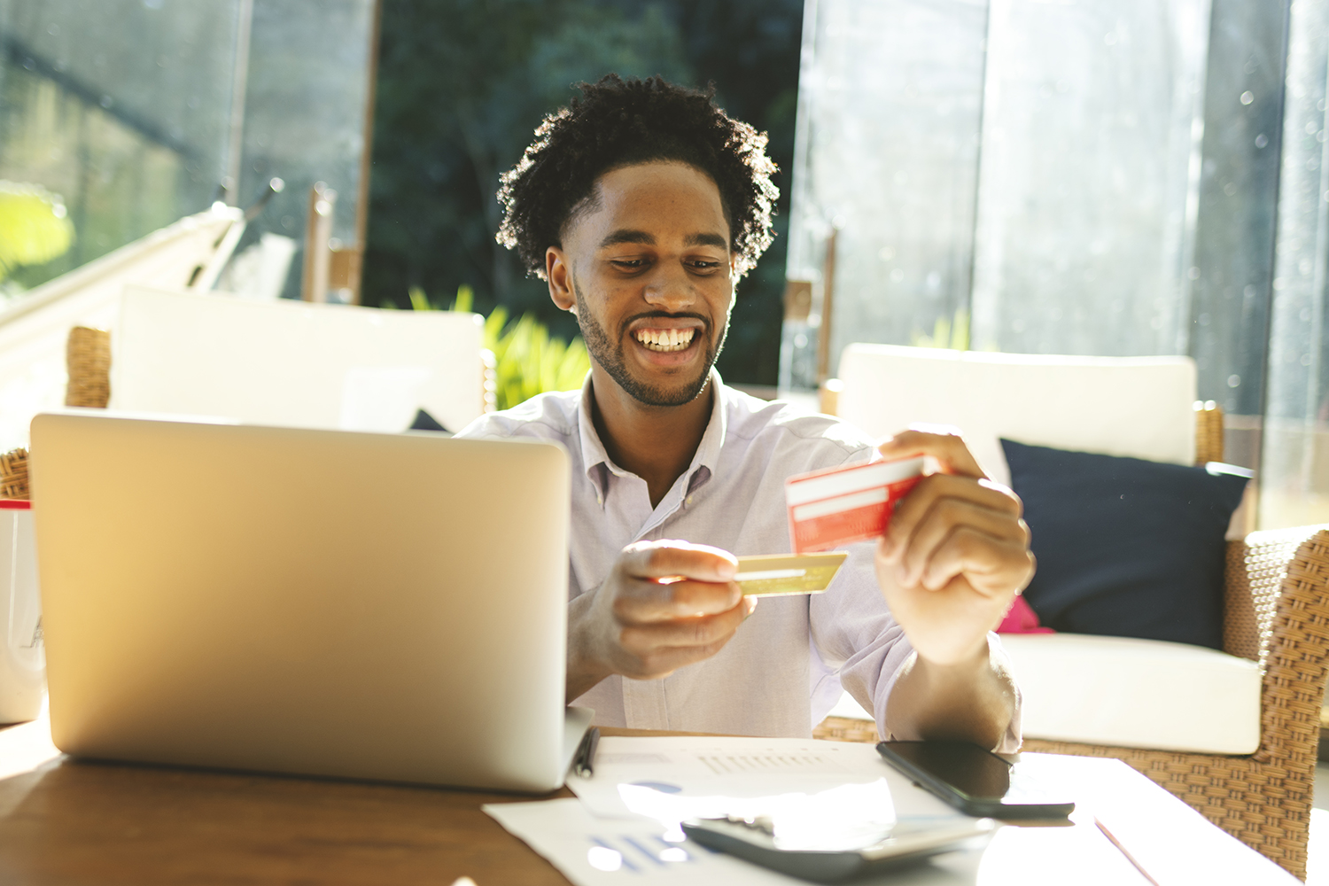 man looking at credit cards