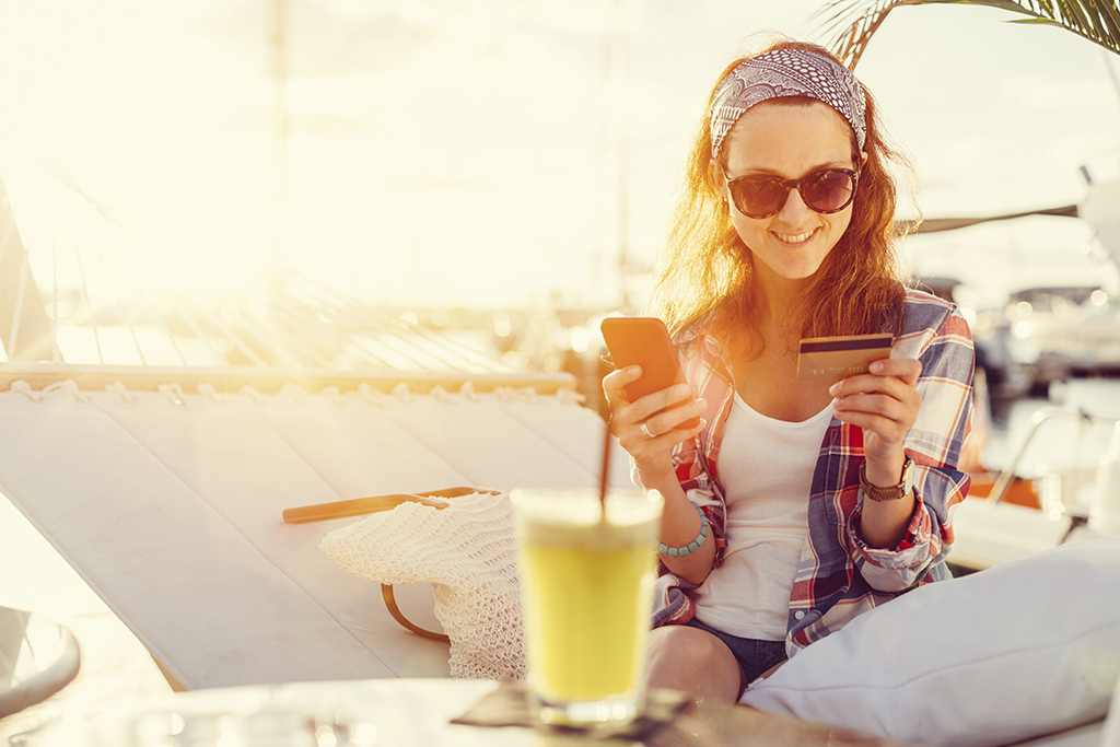 stock photo woman with credit card and phone